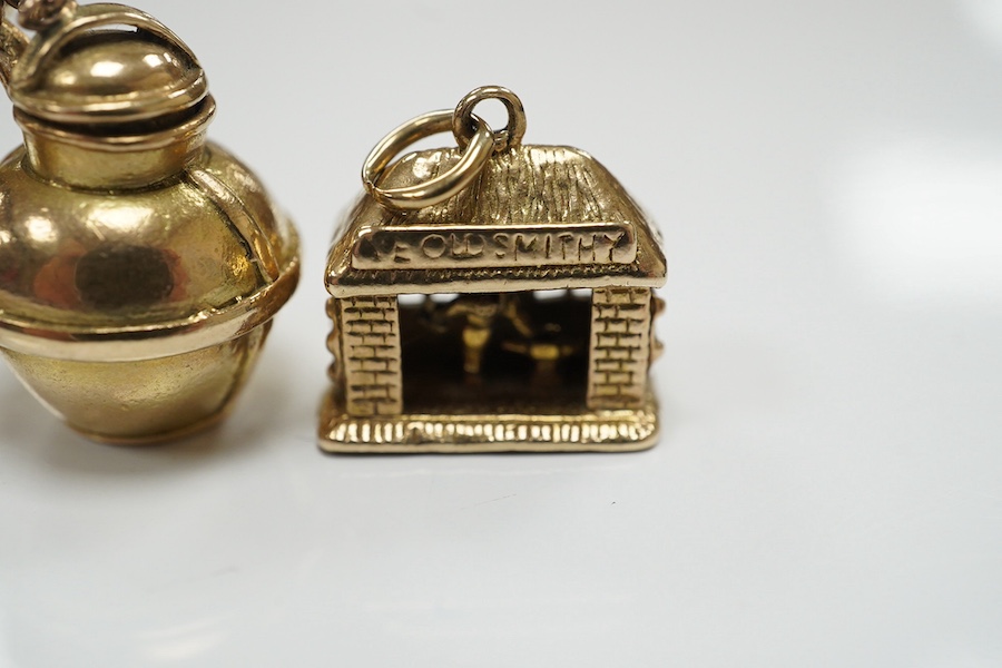 Three assorted 9ct gold charms, including Guernsey milk can and 'Ye Olde Smithy' and one other yellow metal charm, gross 14 grams. Condition - fair to good